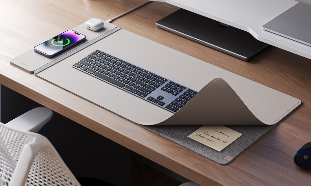 a desktop computer sitting on top of a wooden desk