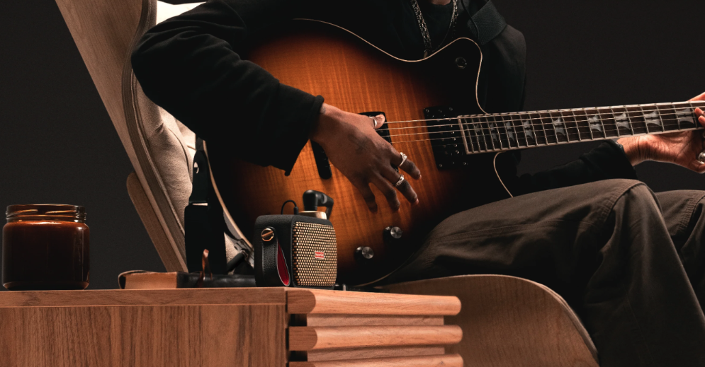 a man holding a guitar