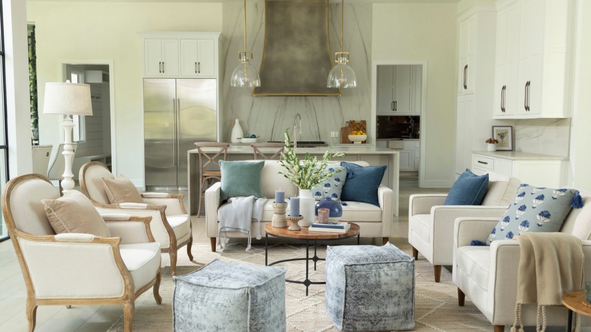 a living room filled with furniture and a fireplace