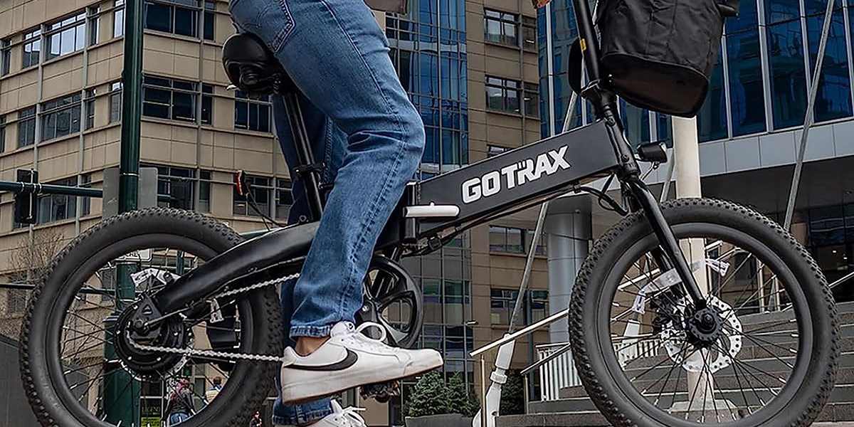 a man doing a trick on a bicycle