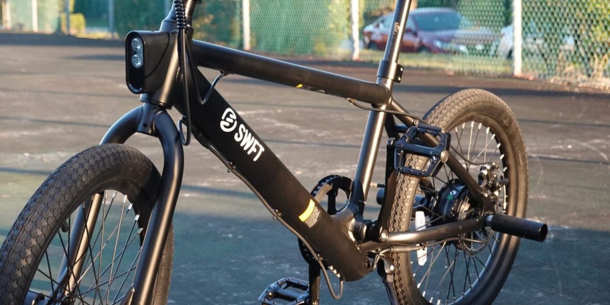 a bicycle parked on the side of a road