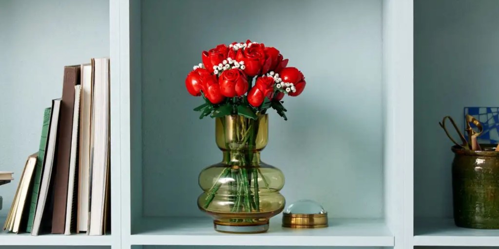 a vase filled with flowers sitting on a table