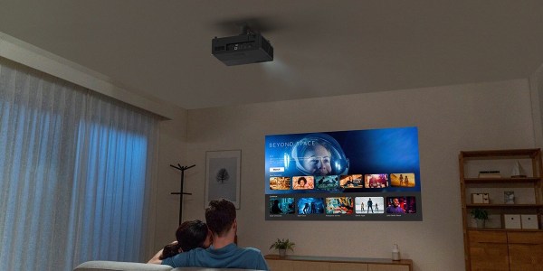 a man sitting in front of a television