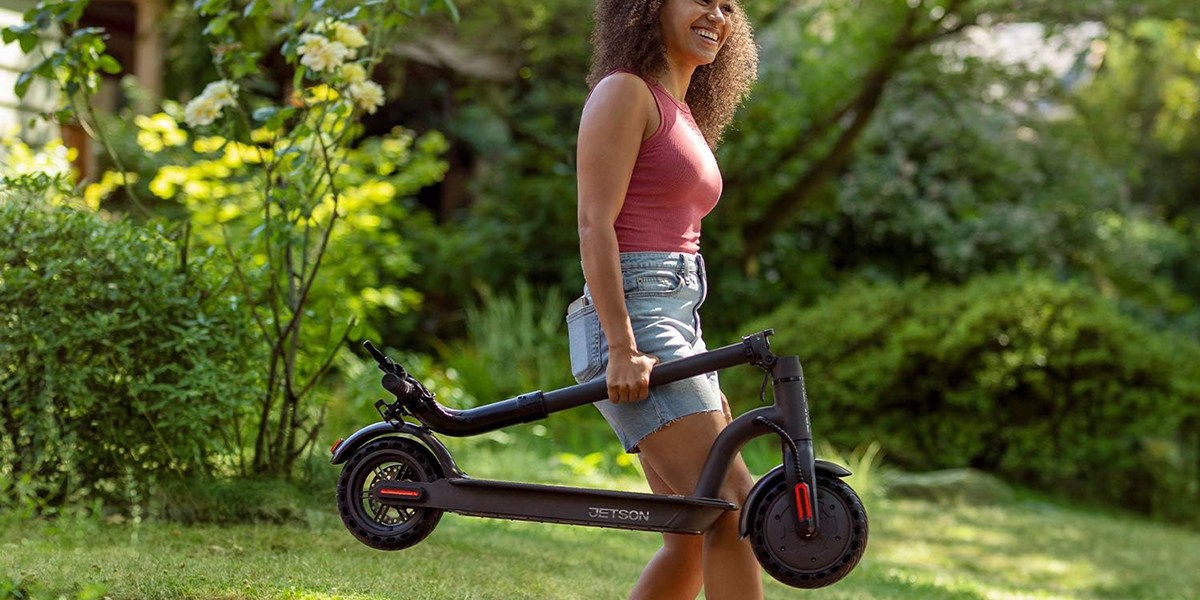 a person riding a bike down a dirt road