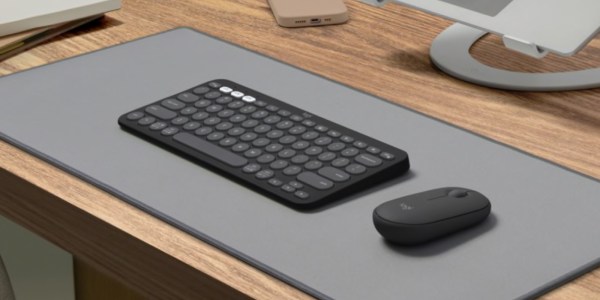 a keyboard and mouse on a desk