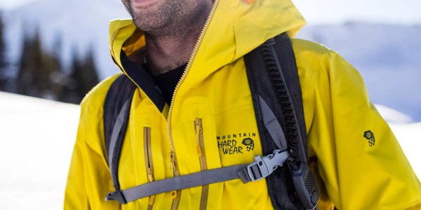 a man wearing a yellow jacket