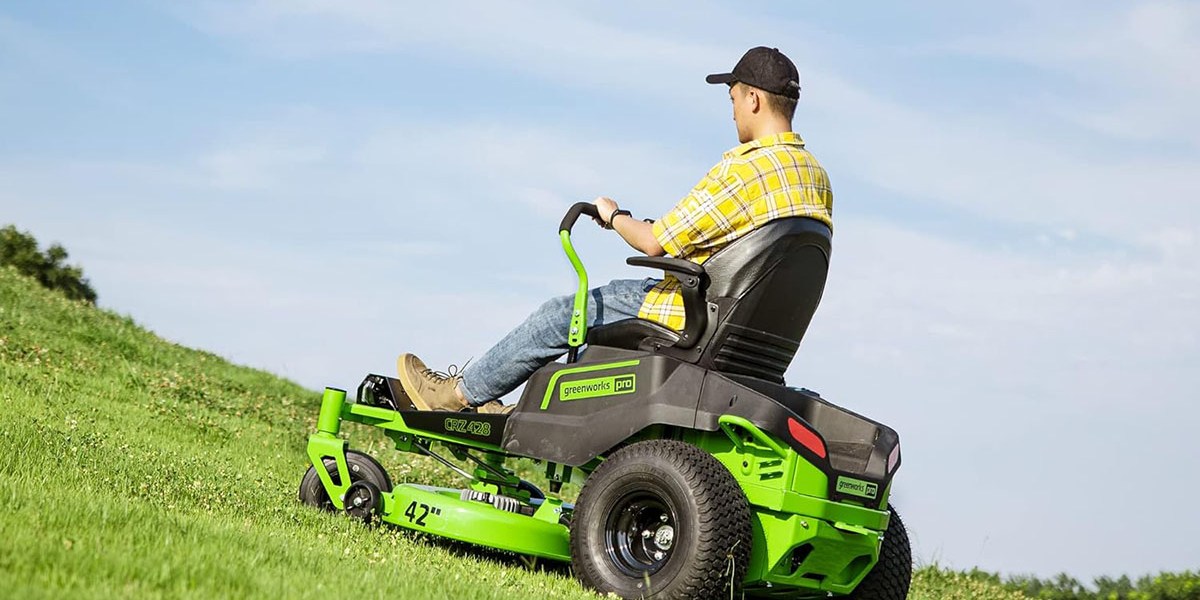 a man riding a lawn mower