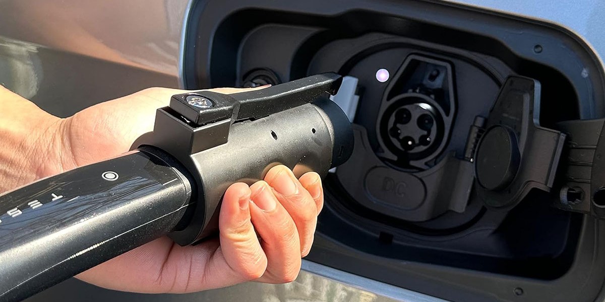 a person holding a steering wheel