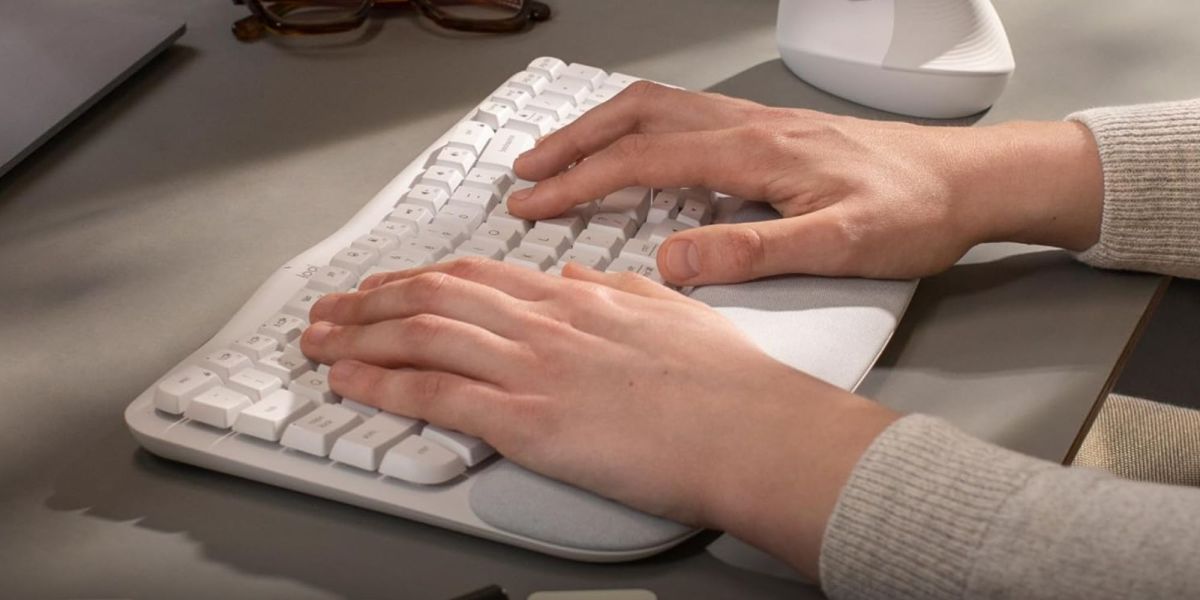 Image showing a person typing on Logitech's Wave Keys keyboard.