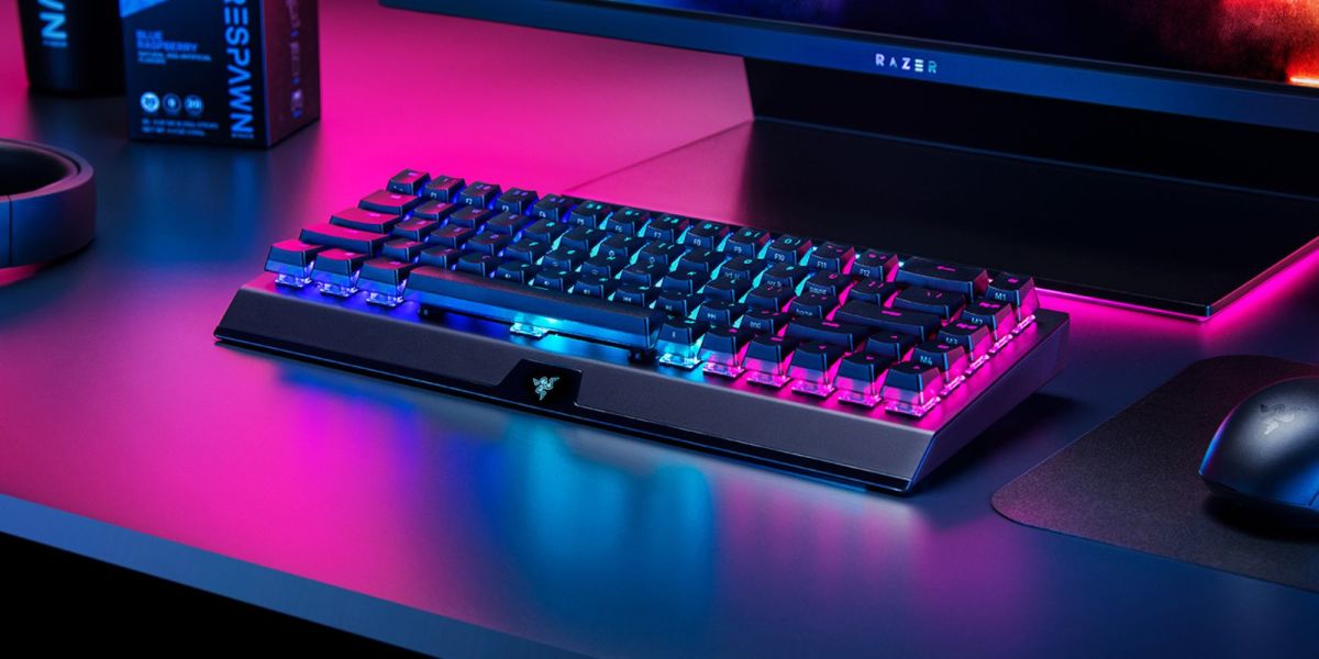 An image showing a Razer BlackWidow V3 Mini wireless gaming keyboard on a desk.