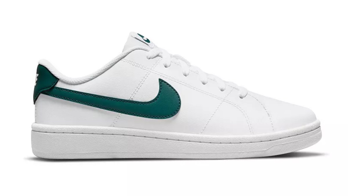 a white and green tennis shoe