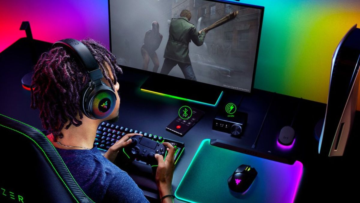 Image showing a person gaming in front of a monitor wearing Razer gaming peripherals.