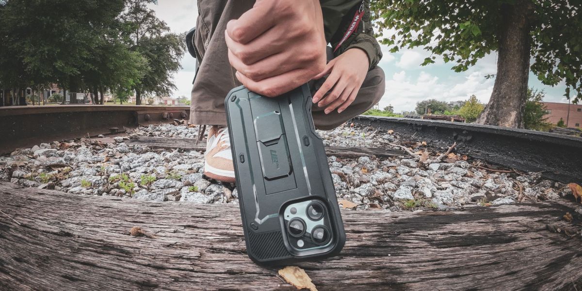 Image showing a person holding an iPhone with SUPCASE UB Pro case.