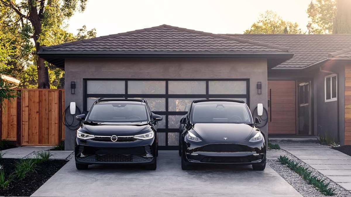 two cars parked in front of a house