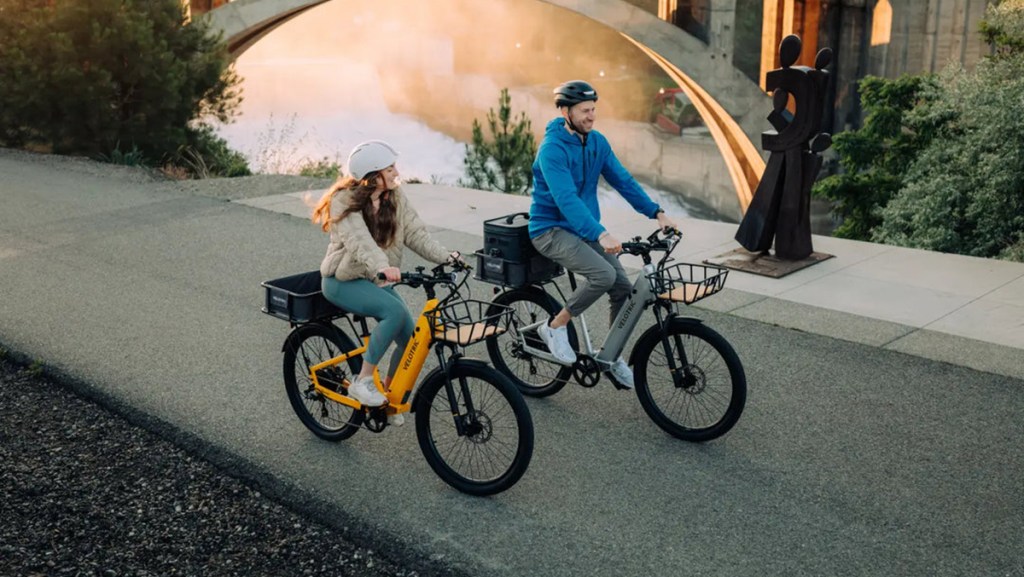 a man and a woman riding bikes