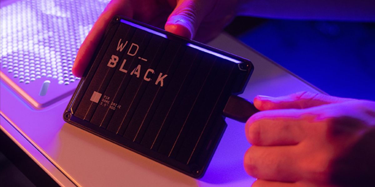 Image showing a person handling WD_BLACK P10 Game Drive.