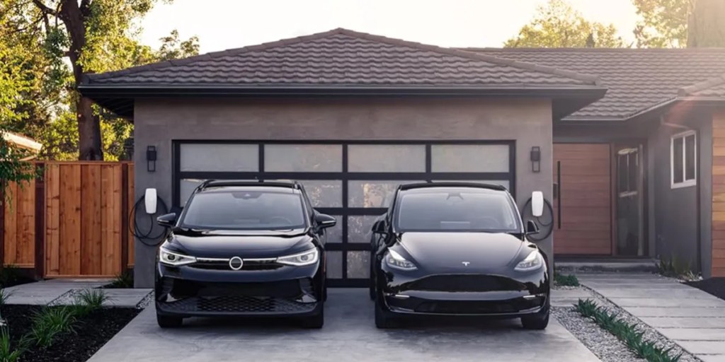 two cars parked in front of a house