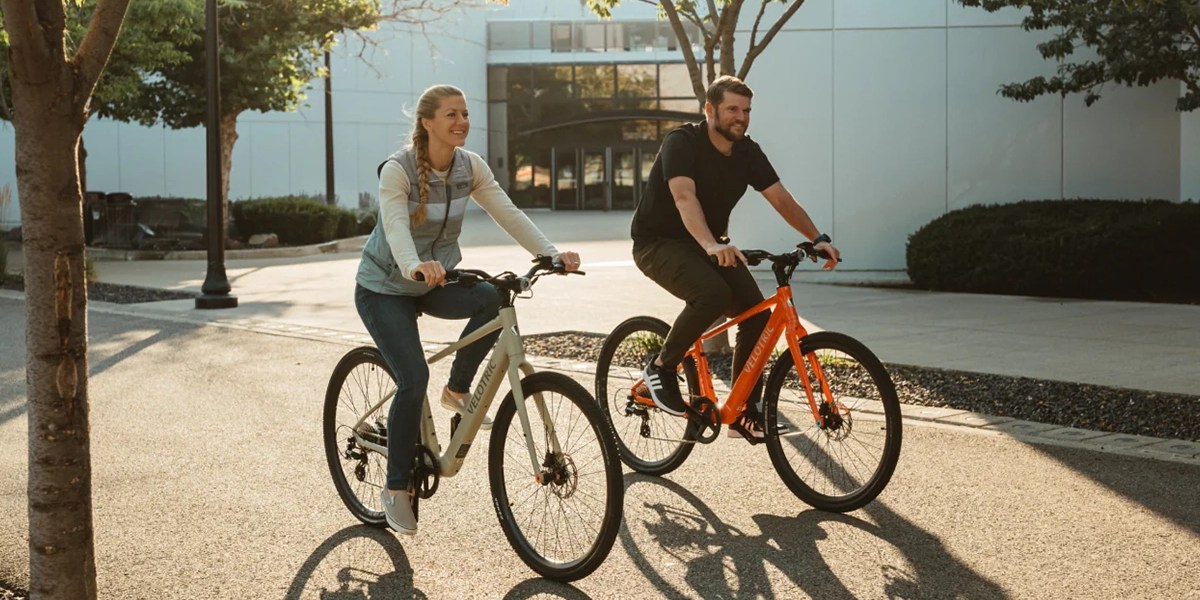 a man and a woman riding bicycles