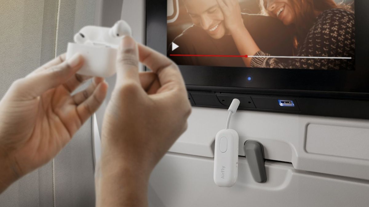 Image showing a person using Twelve South's AirFly Pro Deluxe Bluetooth transmitter.