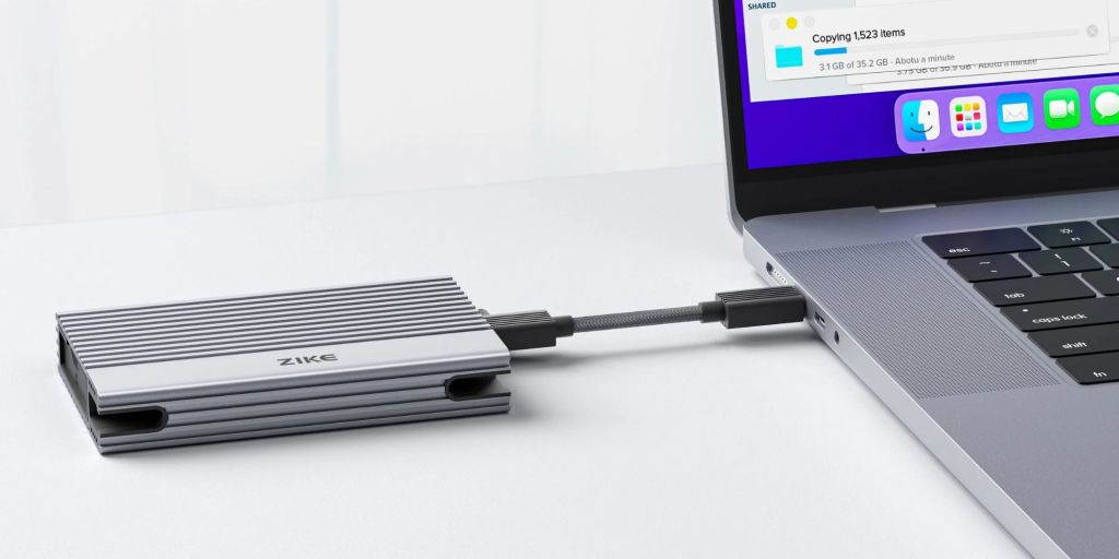 Image showing ZikeDrive Z666 SSD enclosure connected to a MacBook.