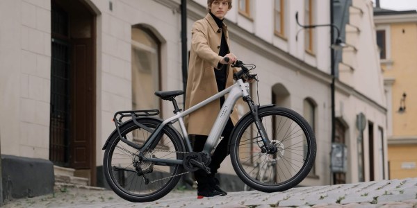 a person standing next to a bicycle