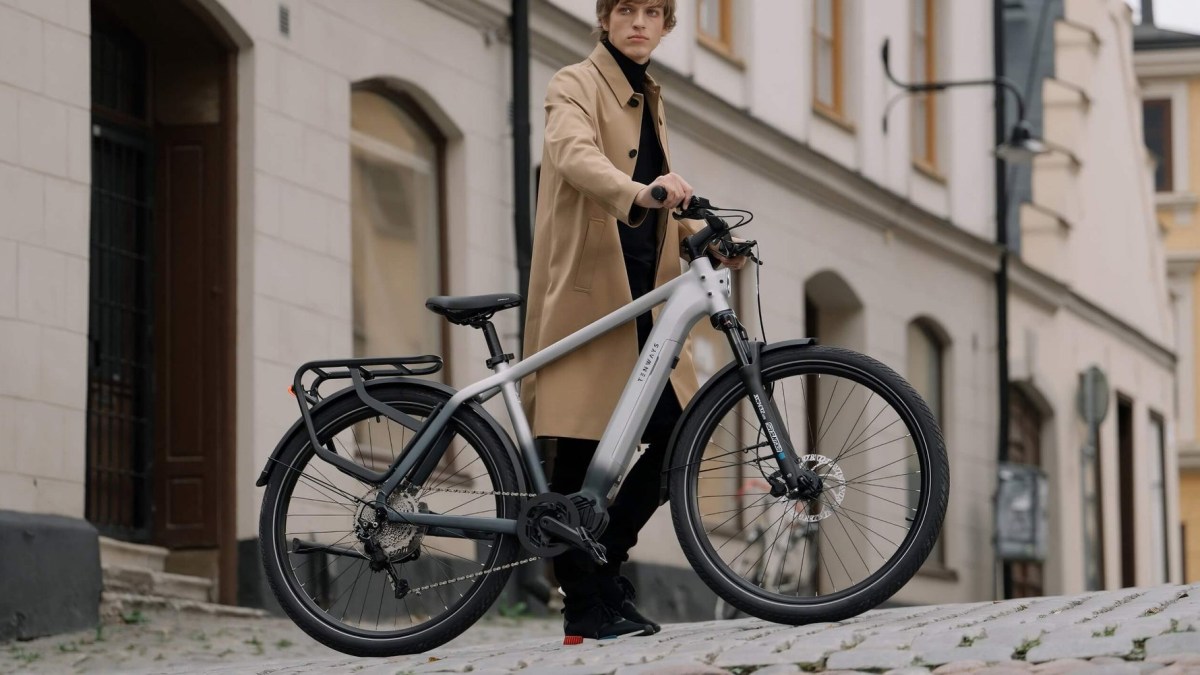 a person standing next to a bicycle